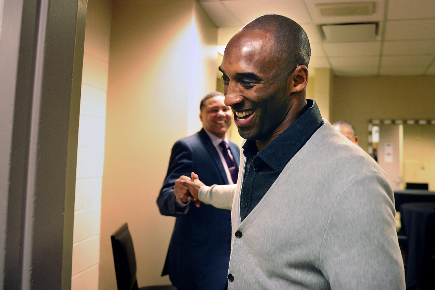 Kobe Bryant greets friends before the Lakers' game against the Pelicans in New Orleans.