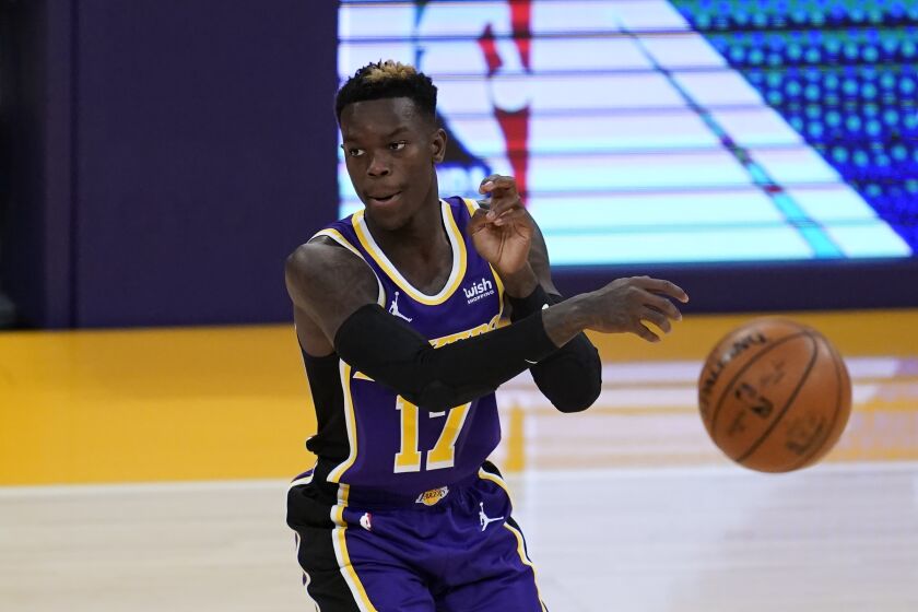 Los Angeles Lakers guard Dennis Schroder (17) passes the ball during the first quarter of an NBA basketball game against the New Orleans Pelicans Friday, Jan. 15, 2021, in Los Angeles. (AP Photo/Ashley Landis)