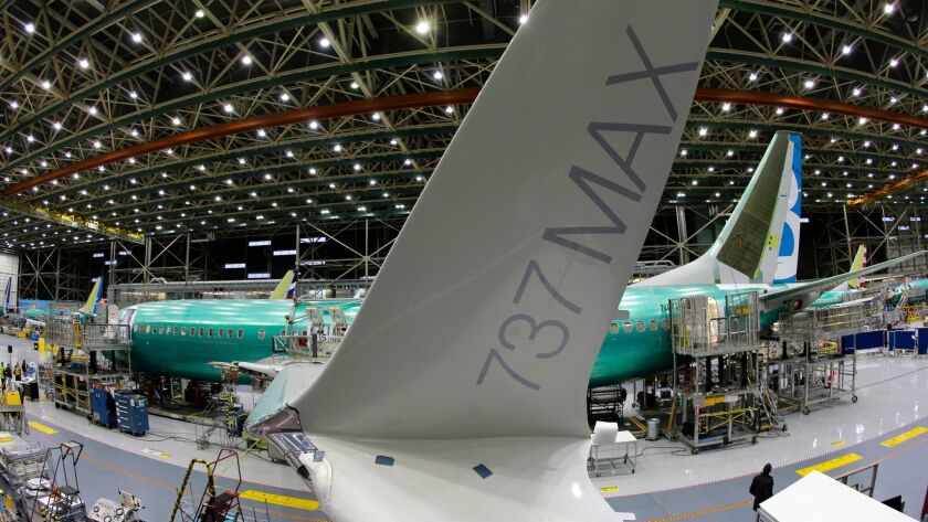 A Boeing 737 Max airplane is shown being built on the assembly line in Renton, Wash. American Airlines flight attendants complained to the company's chief executive about the tiny bathrooms, according to reports. He said he had yet to fly on the plane.