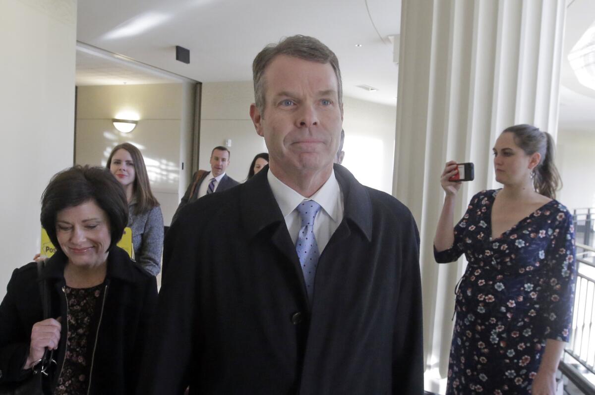 Former Utah Atty. Gen. John Swallow arrives at court Wednesday in Salt Lake City, where his trial got underway this week.