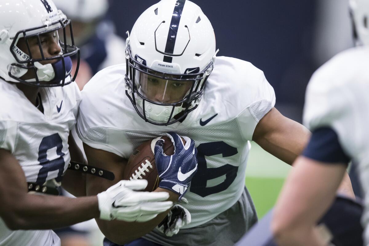 Penn State running back Saquon Barkley runs a drill during football practice in State College, Pa., on Dec. 16.