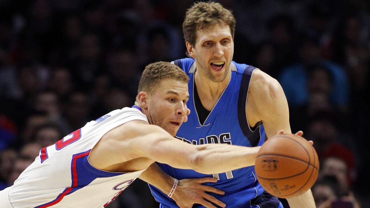 Clippers forward Blake Griffin defends Dallas Mavericks forward Dirk Nowitzki last season. Their teams will meet Oct. 29 in the Clippers' home opener at Staples Center.