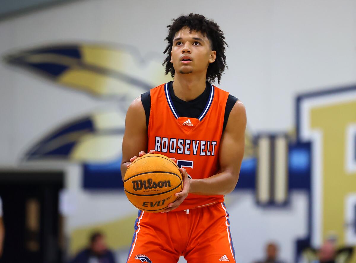 Junior Brayden Burries eyes the basket while preparing to shoot