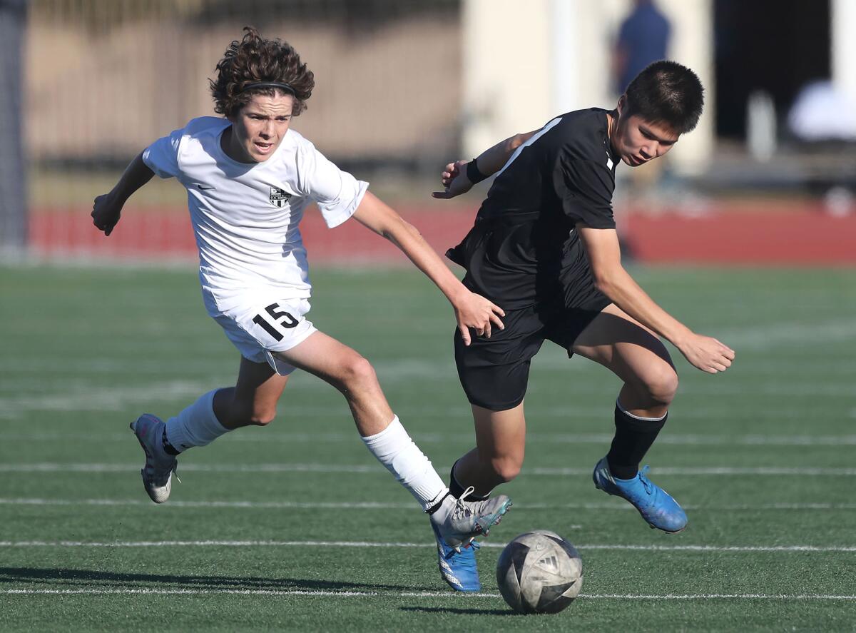 Dylan Petrie-Norris (15) of Laguna Beach moves in for a shot against Marina.