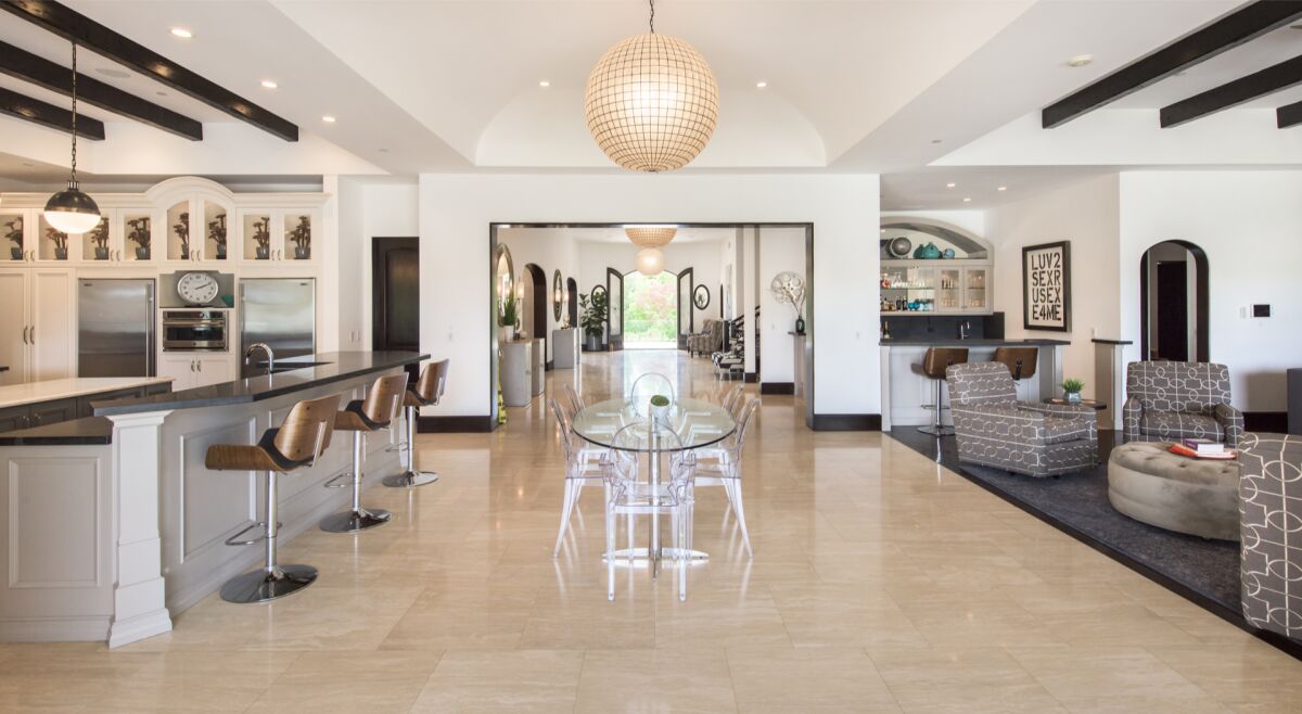 Kathy Griffin's massive Mediterranean estate includes eight bedrooms, 12 bathrooms and a 25,000-gallon infinity pool.