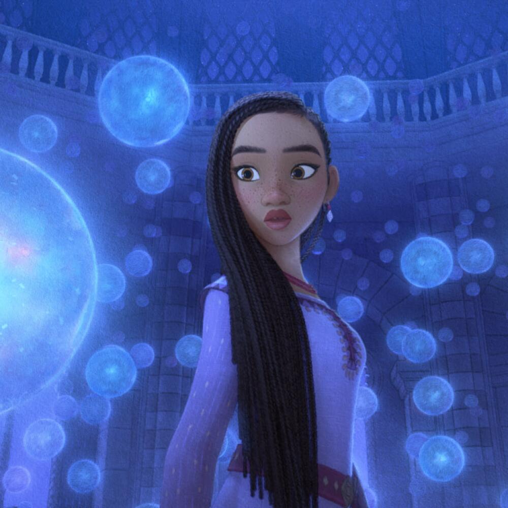 An animated image of a woman surrounded by clear orbs