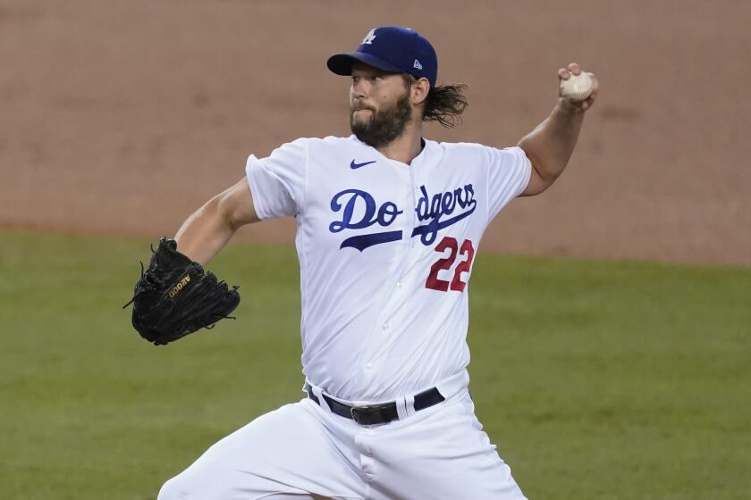 Los Angeles Dodgers starting pitcher Clayton Kershaw throws during the first inning of the team's baseball game.