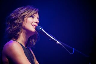 Sarah McLachlan, shown above at a New York concert, is San Diego-bound as part of an intimate tour with cellist/singer Vanessa-Freebairn Smith.