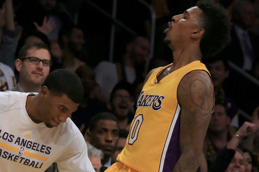 Nick Young celebrates after hitting a three during the second quarter of the Lakers' game Tuesday against the Golden State Warriors.