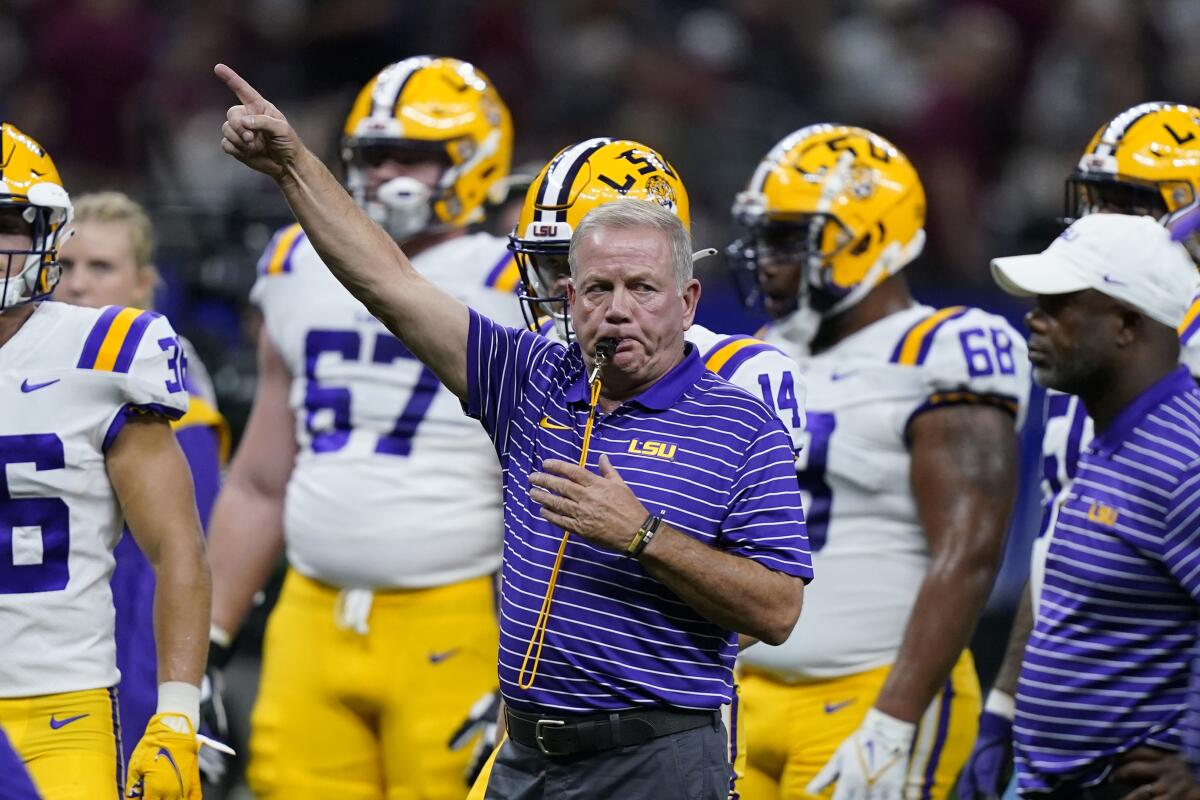 LSU head coach Brian Kelly blows his whistle before an NCAA college football game against Florida State in New Orleans, Sunday, Sept. 4, 2022. (AP Photo/Gerald Herbert)