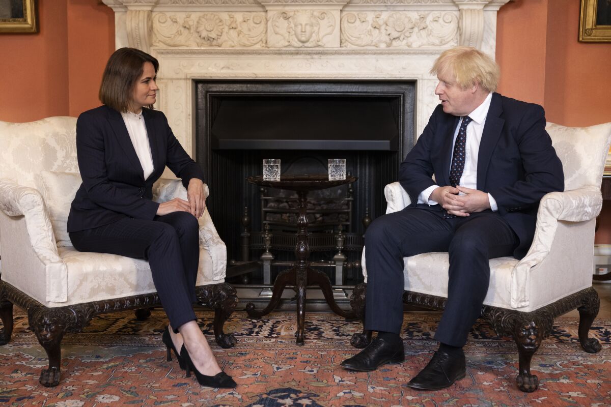 Belarus opposition leader Sviatlana Tsikhanouskaya meets with the British Prime Minister Boris Johnson, right, in 10 Downing Street, London, Tuesday, Aug. 3, 2021. (Dan Kitwood/Pool via AP)