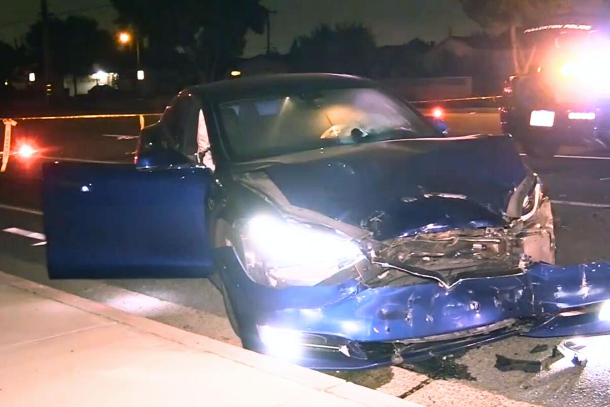 A driver in a Tesla car crashed into a police cruiser in Orange County