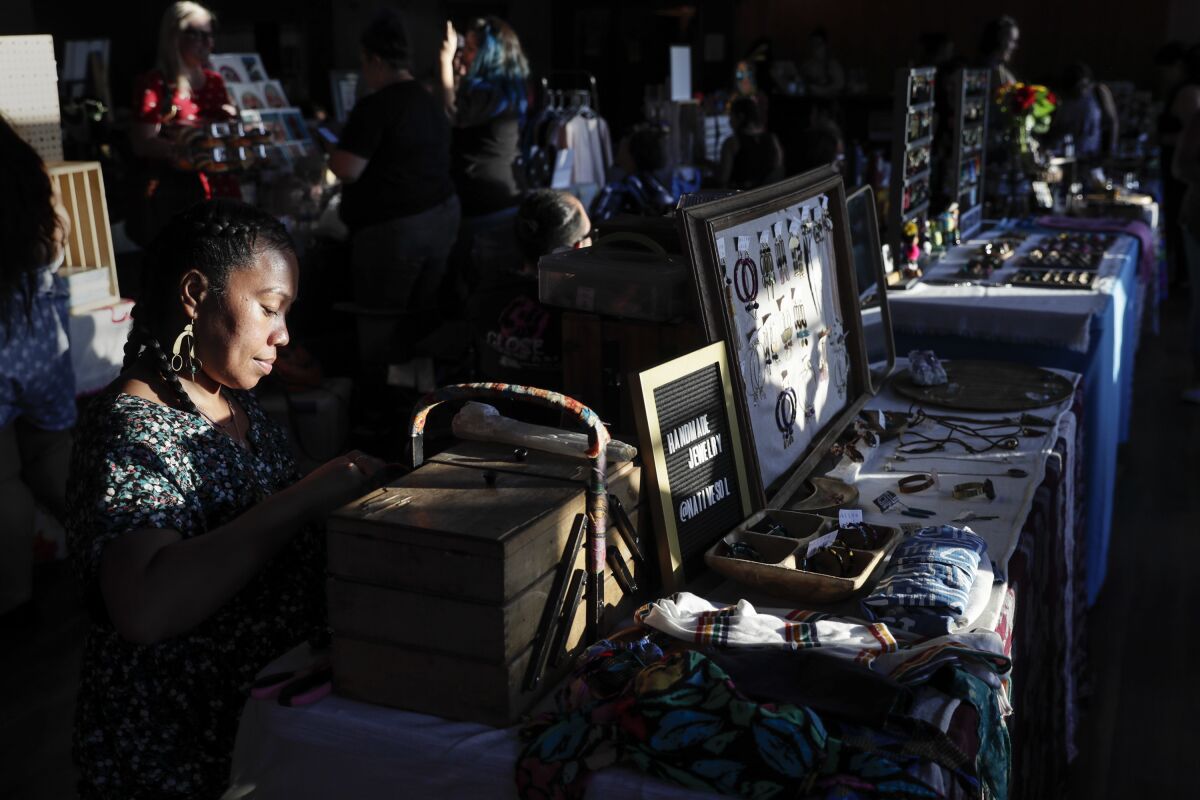 May Salem sells her Native Sol handmade jewelry and clothes at Mujeres Market.