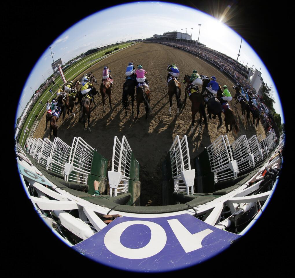The horses break from the starting gate for the 141st Kentucky Derby on Saturday at Churchill Downs in Louisville, Ky.