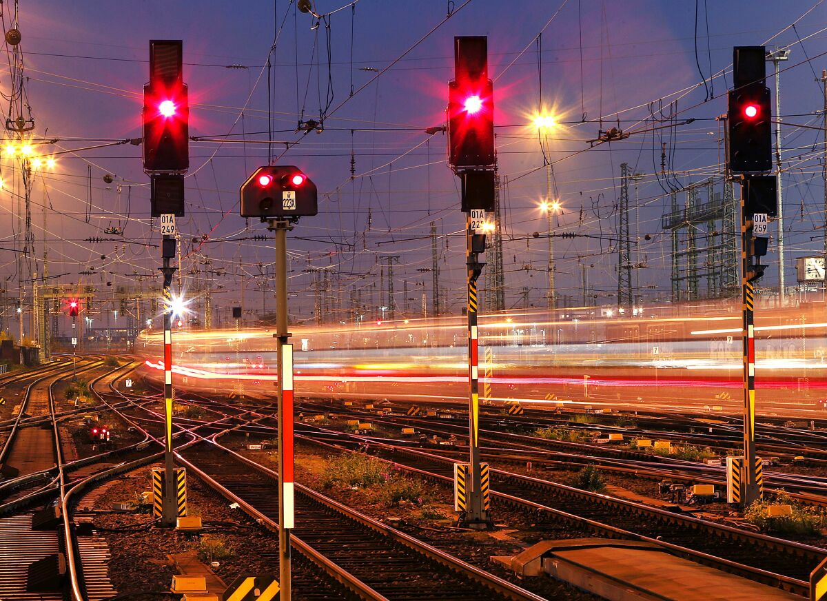 FILE - In this Wednesday, Oct. 17, 2018 file photo a train leaves at night the main train station in Frankfurt, Germany. Four European rail companies announced Tuesday they plan to boost the continent’s network of night train connections by reviving routes that were dropped several years ago for cost reasons. (AP Photo/Michael Probst, File)