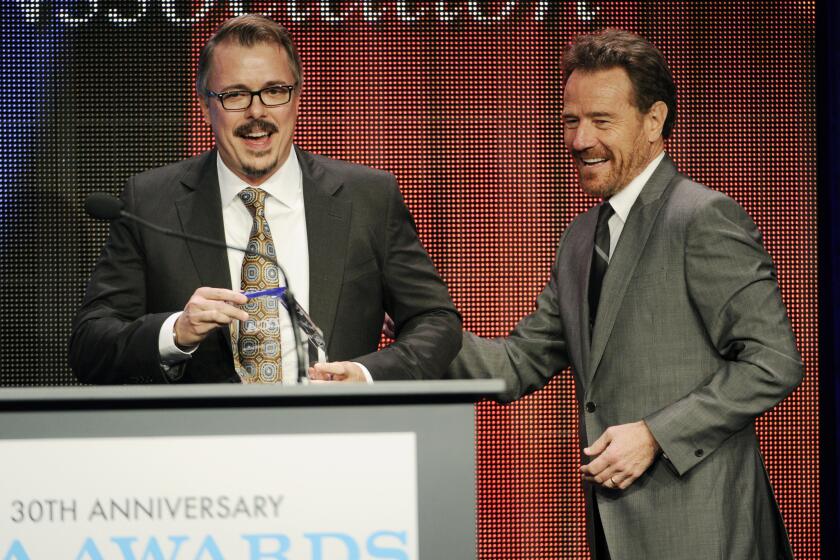 Vince Gilligan, left, creator and executive producer of the television series "Breaking Bad," and the show's star Bryan Cranston take the stage to accept the Program of the Year award at the 30th Annual Television Critics Assn. Awards Show at the Beverly Hilton on Saturday in Beverly Hills.