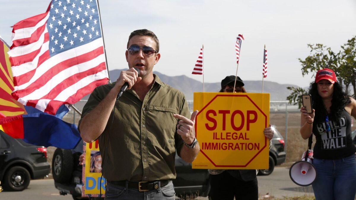 Rep. Duncan Hunter (R-Alpine) speaks to supporters at a "Build the Wall" rally held near border wall prototypes in 2017.