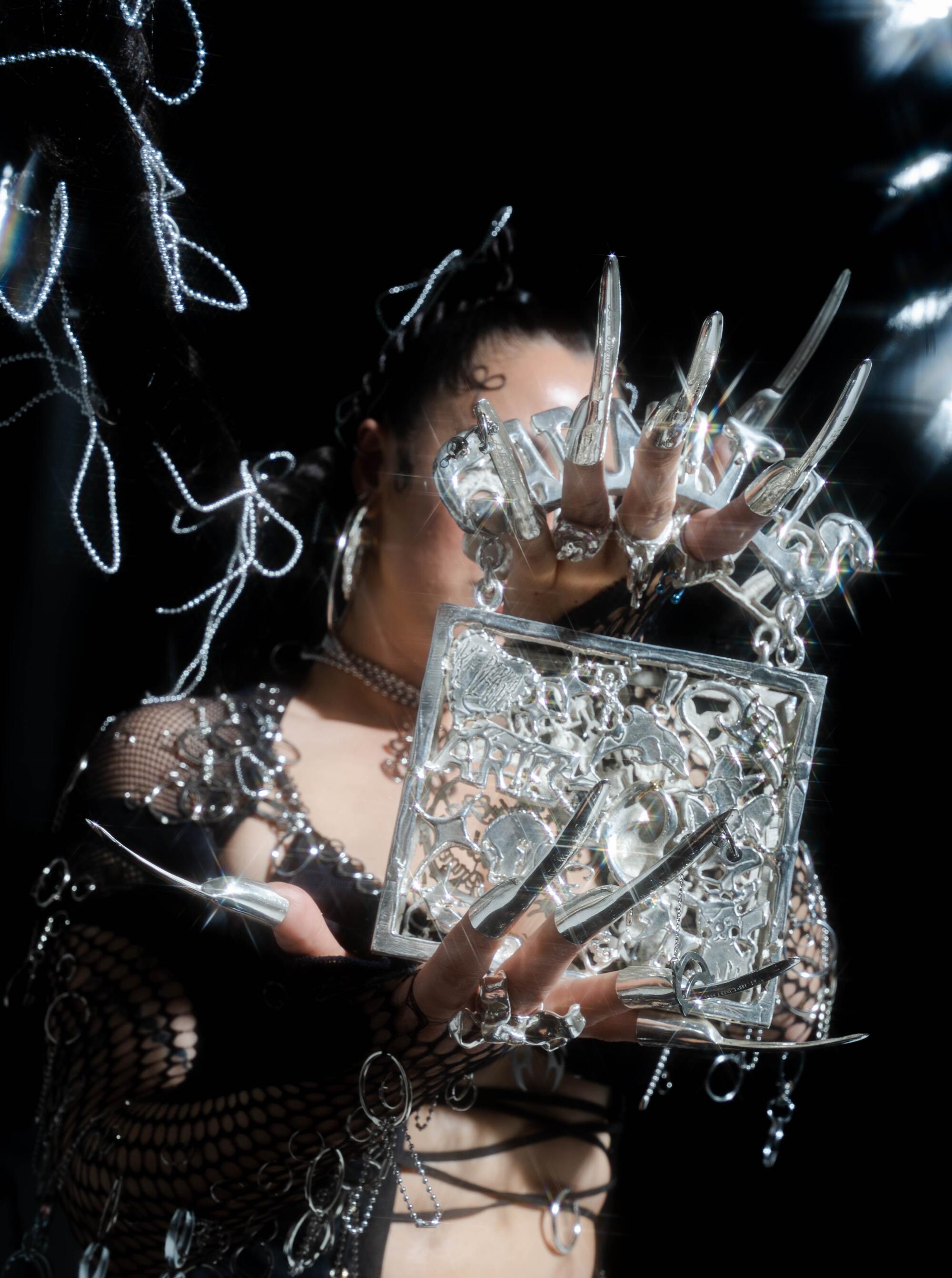 Photo of “KEPERRA” — a sterling silver casted purse made by Georgina Trevio for Image magazine.