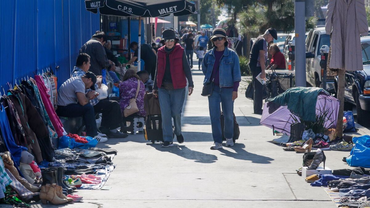 Vendors sell shoes, clothing and an array of other goods along the sidewalks of Vermont Avenue in East Hollywood.