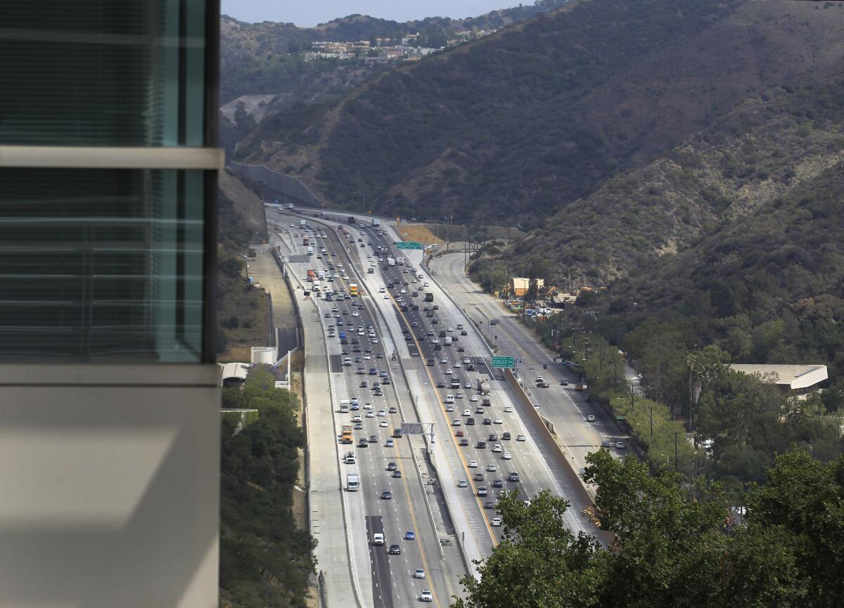 L.A. and county officials celebrated the opening of the new northbound carpool lane on the 405 Freeway through the Sepulveda Pass.