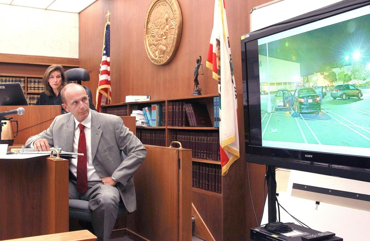 San Diego Police idetective Tim Norris testified in the case of Carlo Gallopa Mercado and looked to a photo of the scene of the murder of Flint and Salvatore Belvedere. — John Gastaldo