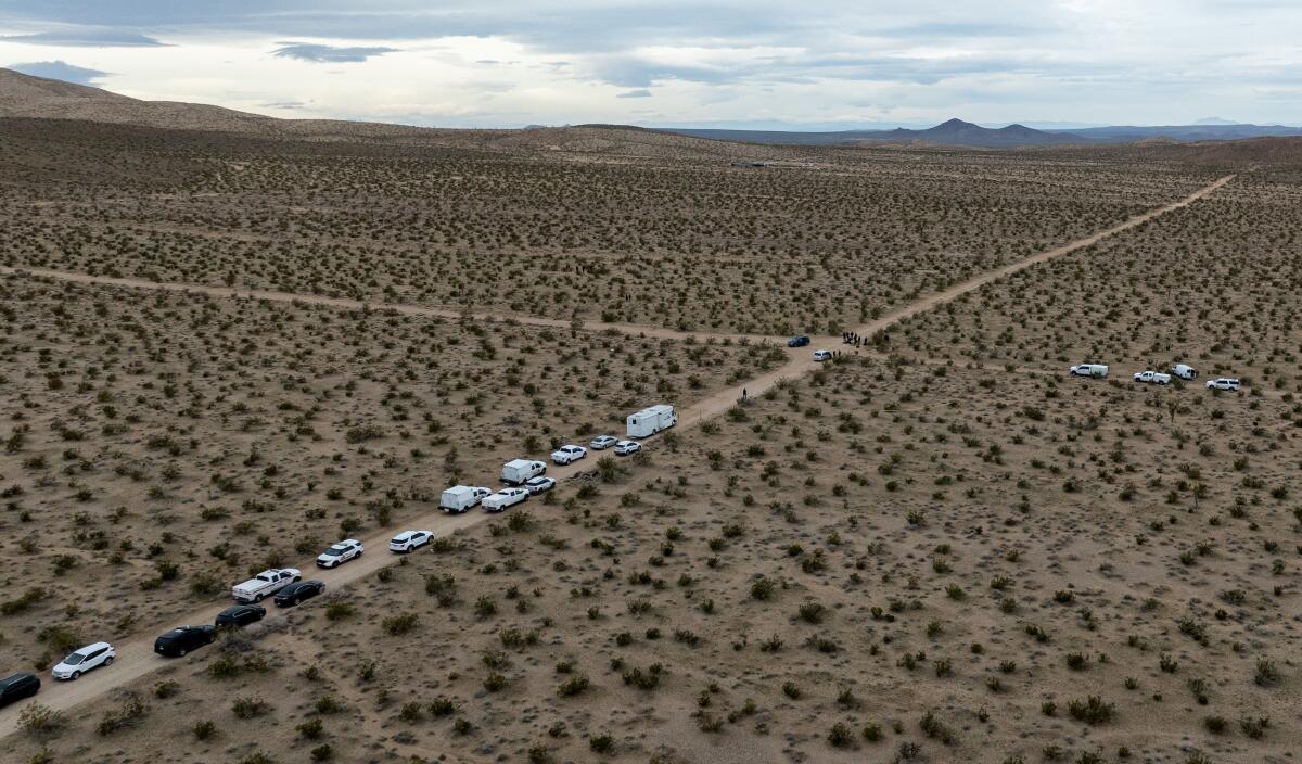 A line of cars in a remote area of San Bernardino County.