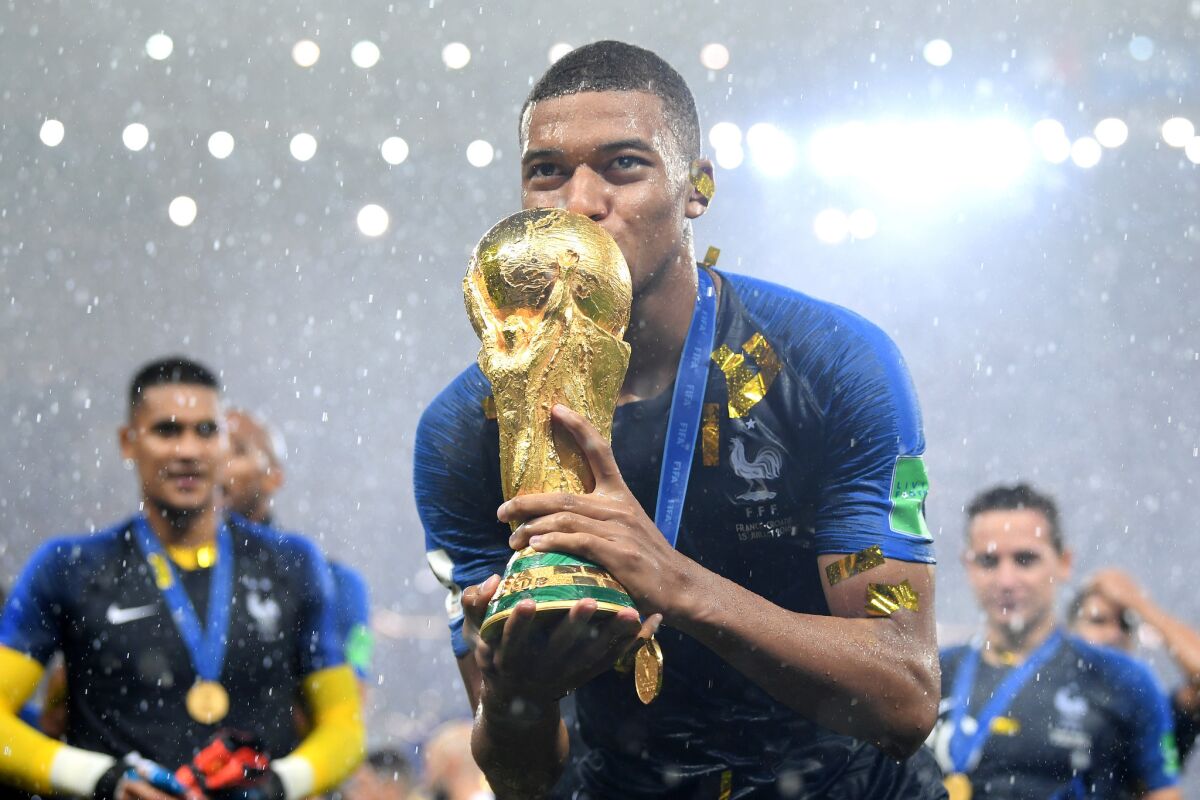 Kylian Mbappe of France celebrates with the World Cup Trophy following his sides victory in the 2018 FIFA World Cup Final between France and Croatia at Luzhniki Stadium on July 15, 2018 in Moscow, Russia.