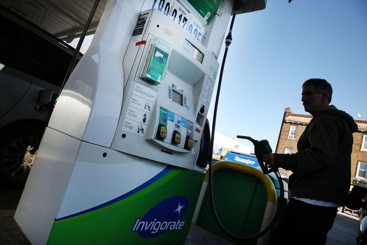 A customer fills up his car at a BP gas station in Brooklyn, N.Y., on Feb. 2.