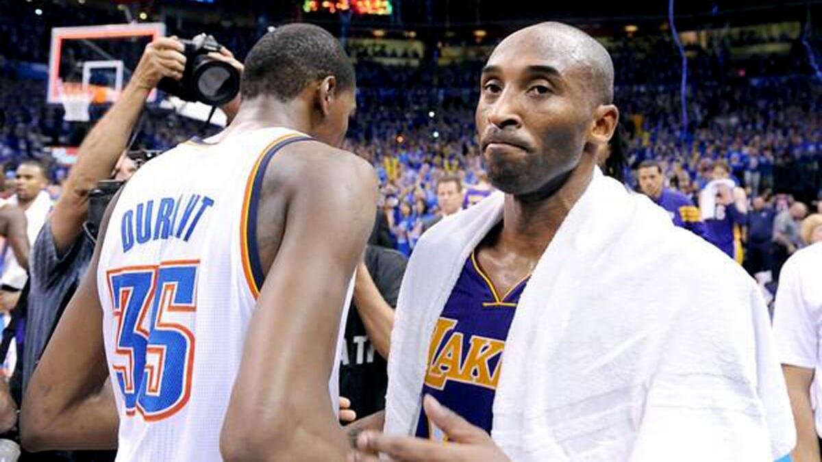 Guard Kobe Bryant leaves the court after congratulating Oklahoma City forward Kevin Durant following a Lakers loss in 2012.