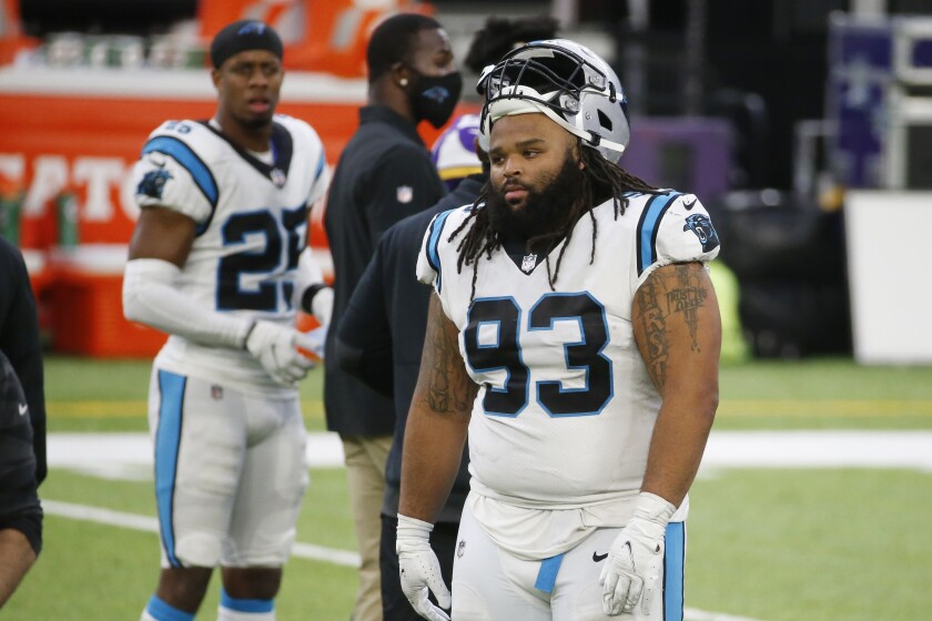Carolina Panthers defensive tackle Bravvion Roy (93) walks off the field after an NFL football game against the Minnesota Vikings, Sunday, Nov. 29, 2020, in Minneapolis. The Vikings won 28-27. (AP Photo/Bruce Kluckhohn)