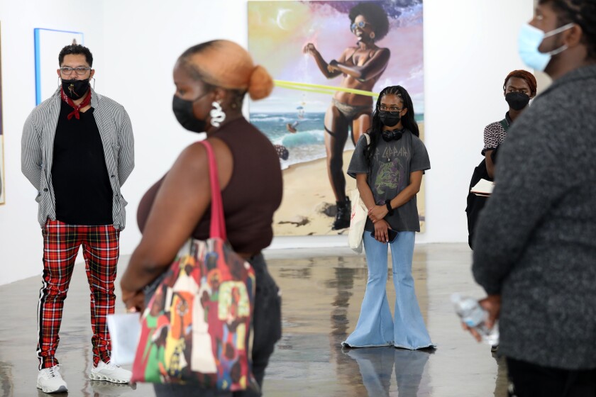Terrell Telford, left, owner of Band of Vices Art Gallery