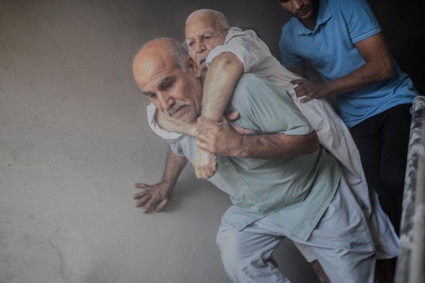 TOPSHOT - An elderly man is evacuated from a building in Akcakale, a town near the Turkish border with Syria on October 13, 2019, after it was hit by a rocket reported to be fired from within Syria. - A total of 18 civilians and at least four Turkish soldiers have been killed since Turkey launched its offensive against the US-backed Kurdish People's Protection Units (YPG) militia in Syria on October 9, 2019. (Photo by BULENT KILIC / AFP) (Photo by BULENT KILIC/AFP via Getty Images) ** OUTS - ELSENT, FPG, CM - OUTS * NM, PH, VA if sourced by CT, LA or MoD **