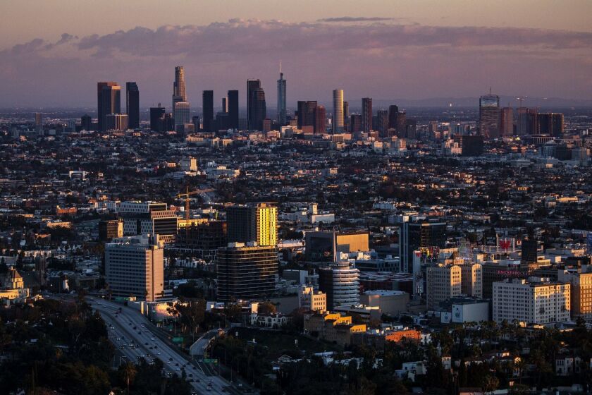 LOS ANGELES, CALIF. - DECEMBER 25: The Downton Los Angeles skyline sits as a backdop to the Hollywood and the motorists driving up and down the 101 Freeway, seen from the Jerome C. Dnaiel Overlook above the Hollywood Bowl on Tuesday, Dec. 25, 2018 in Los Angeles, Calif. (Kent Nishimura / Los Angeles Times)