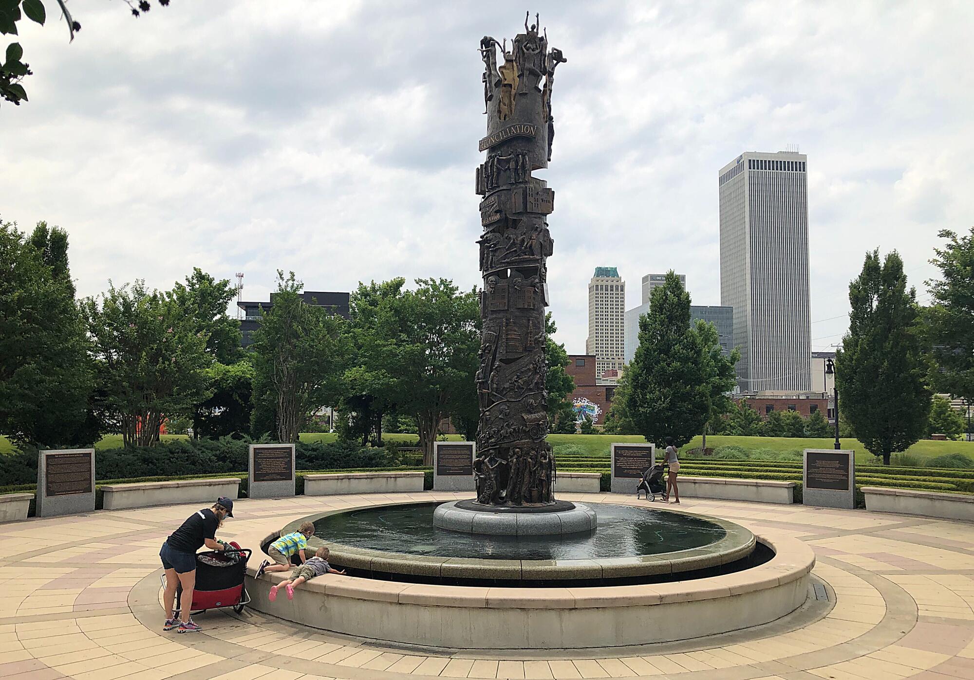 Teshayla Bell, 23, with her son Jaylon Tarbell, 2, at John Hope Franklin Reconciliation Park in Tulsa, Okla.