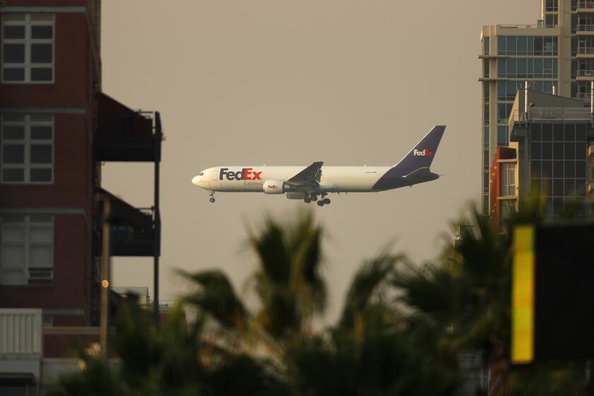 SAN DIEGO, CA - SEPTEMBER 9: A FedEx 767 airplane approaches San Diego International Airport for a landing on Thursday, Sept. 9, 2020 in San Diego, CA. (K.C. Alfred / The San Diego Union-Tribune)