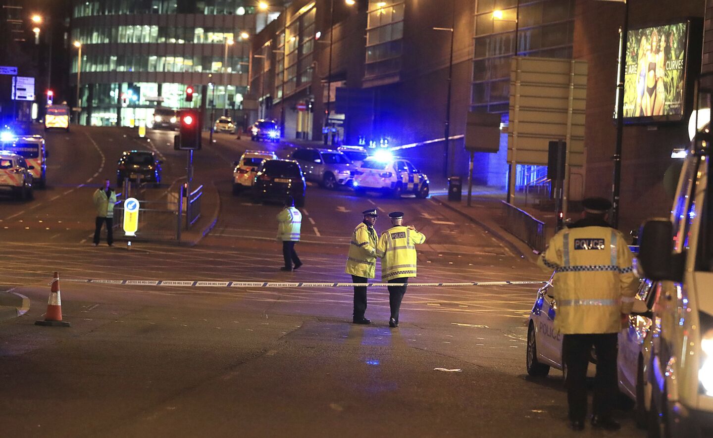 Emergency services work at Manchester Arena after reports of an explosion during an Ariana Grande concert.