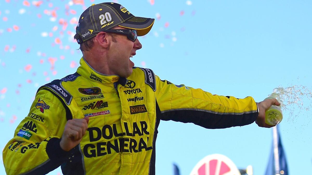 Matt Kenseth celebrates in Victory Lane after winning the NASCAR Sprint Cup Series Sylvania 300 at New Hampshire Motor Speedway on Sunday.