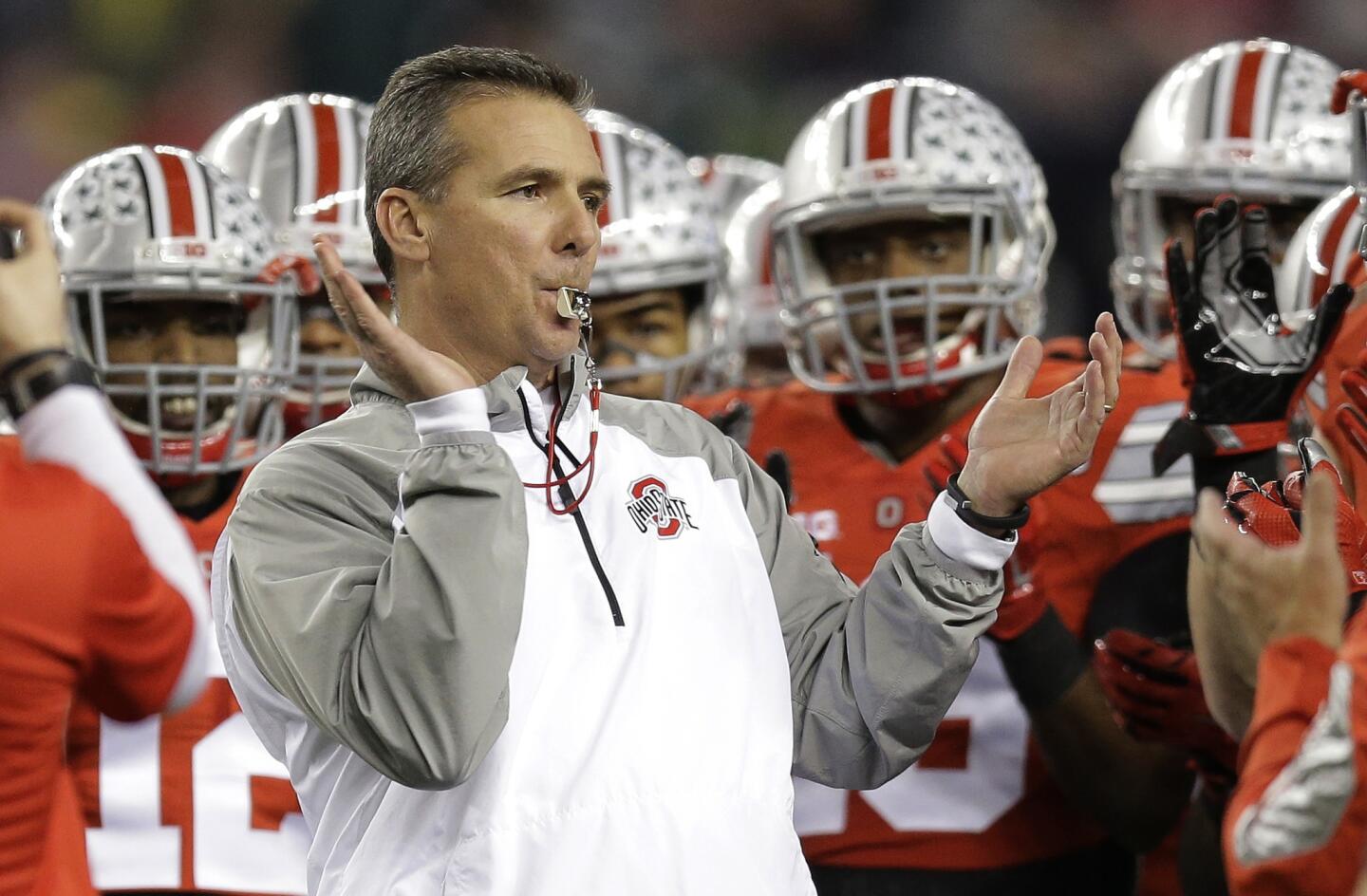 Ohio State head coach Urban Meyer rallies his players before the NCAA college football playoff championship game against Oregon Monday, Jan. 12, 2015, in Arlington, Texas. (AP Photo/Eric Gay)