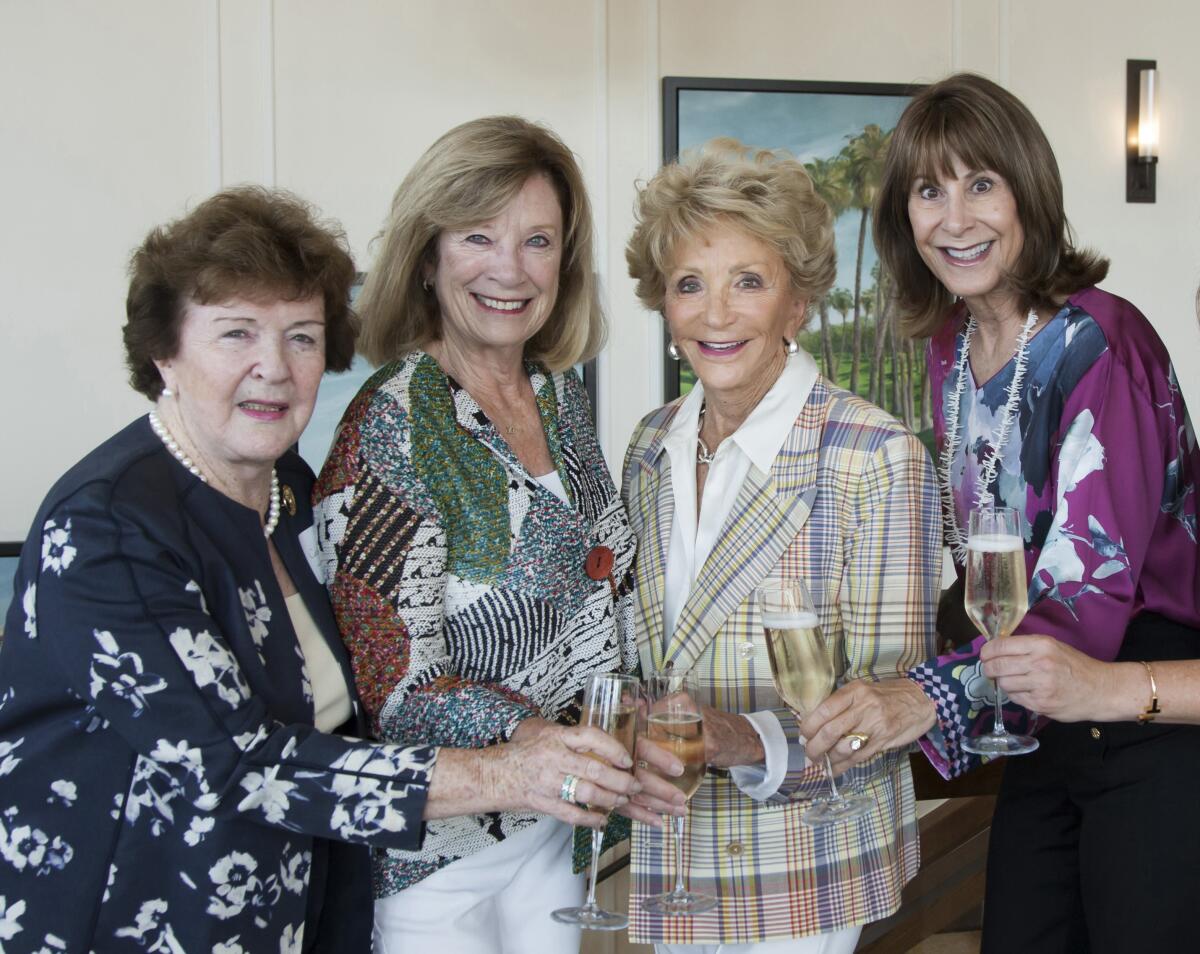 Catherine Thyen, Harriet Harris, Barbara Bowie, and Kate Eastman celebrate the upcoming Angelitos de Oro event.