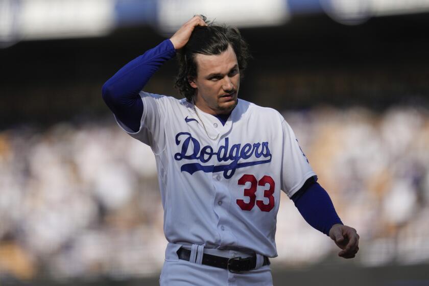 Los Angeles Dodgers' James Outman (33) returns to the dugout during a baseball game against the New York Yankees in Los Angeles, Sunday, June 4, 2023. (AP Photo/Ashley Landis)