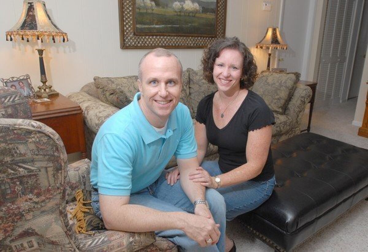 Alan Chambers, left, president of Exodus International, with his wife, Leslie, in their home in Florida in 2006.