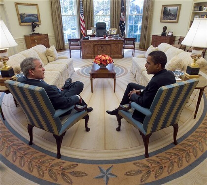 In this photo released by the White House, President Bush and President-elect Obama meet in the Oval Office of the White House Monday, Nov. 10, 2008, in Washington. (AP Photo/The White House, Eric Draper)