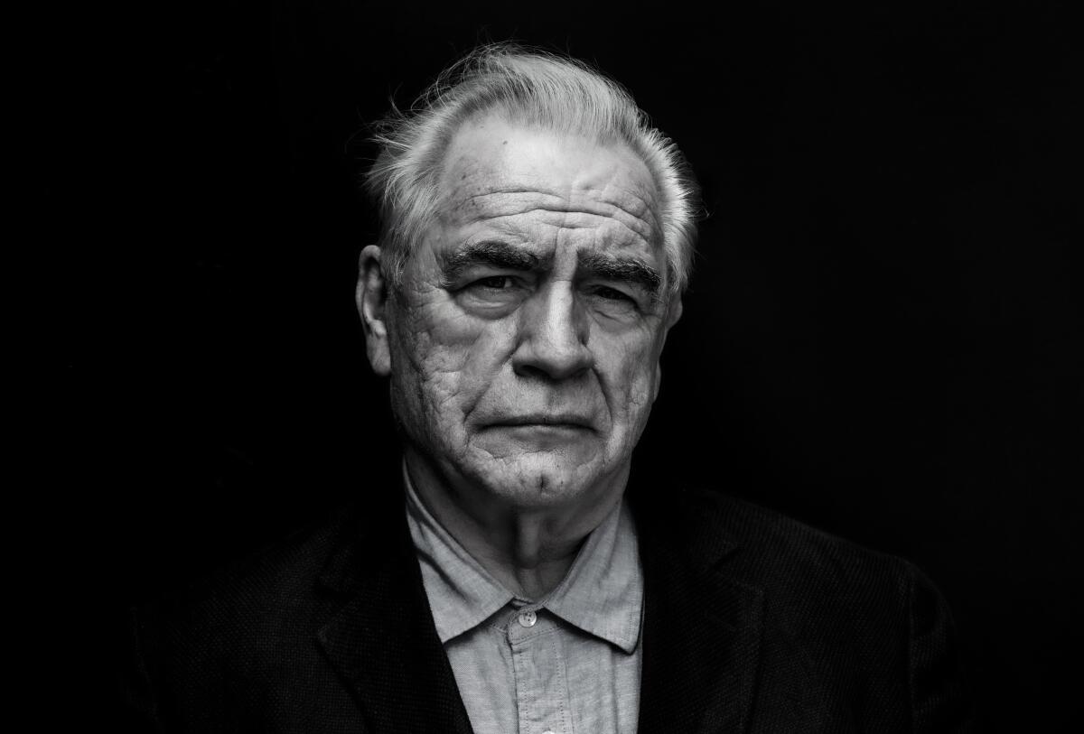 Brian Cox in a black and white photo, with a furrowed brow. 