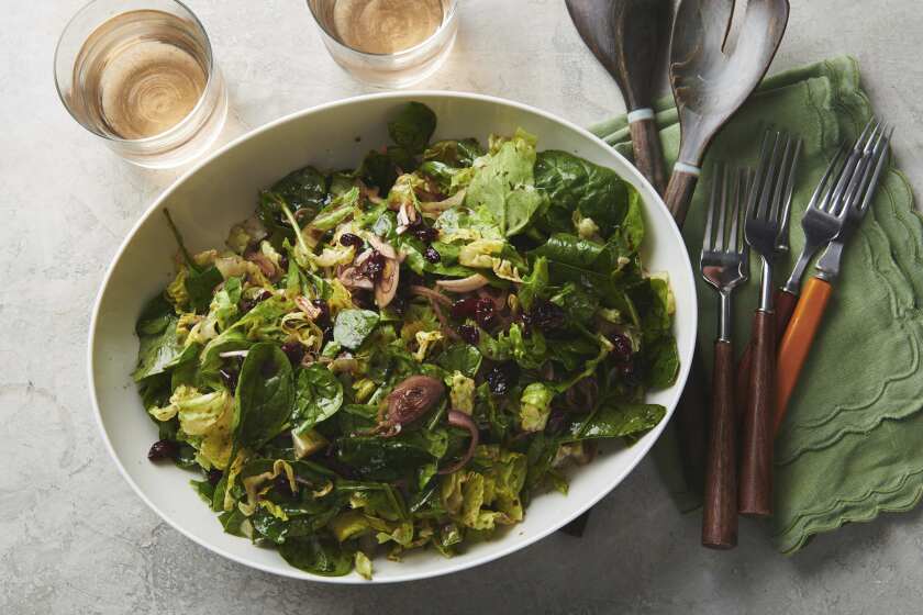 This August 2019 photo shows an autumn salad with a homemade vinaigrette. If you take a couple of minutes to play with some different oils and vinegars, you’ll quickly see how easy it is to make a vinaigrette, and to keep changing it up so your salads sparkle all year long. At its most basic, you can make a vinaigrette in two minutes. (Cheyenne M. Cohen via AP)