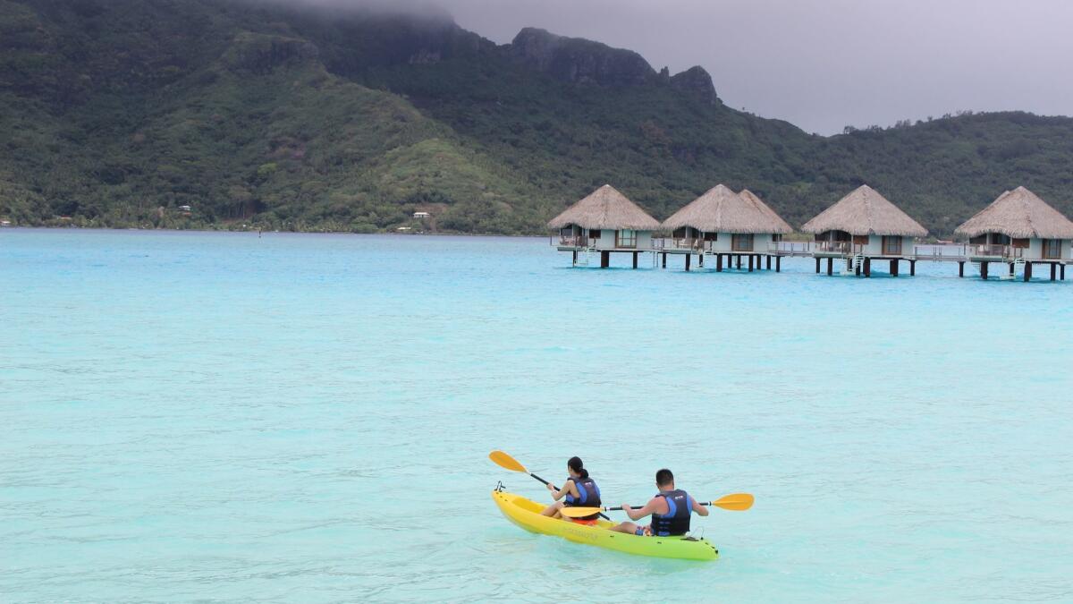 Kayakers head out on the water from Le Meridien resort in Bora Bora. Stories about people struggling with six-figure incomes can discount how much they’re spending on expensive vacations and other items out of reach of average Americans.