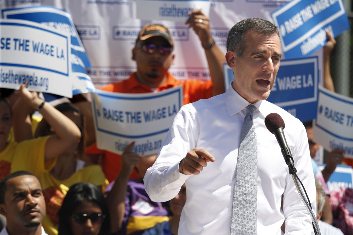Mayor Eric Garcetti announces his plan to raise the minimum wage in Los Angeles on Sept. 1.