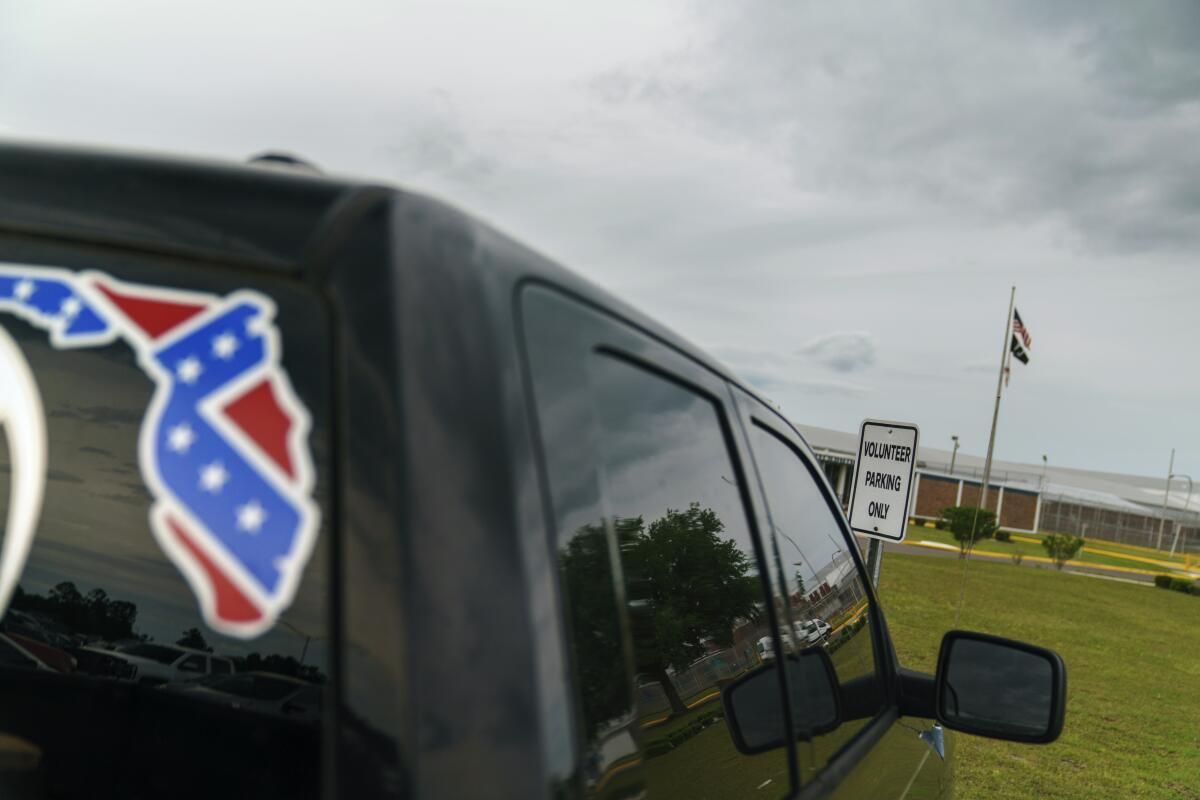 A pickup truck with a Confederate flag-themed decal 