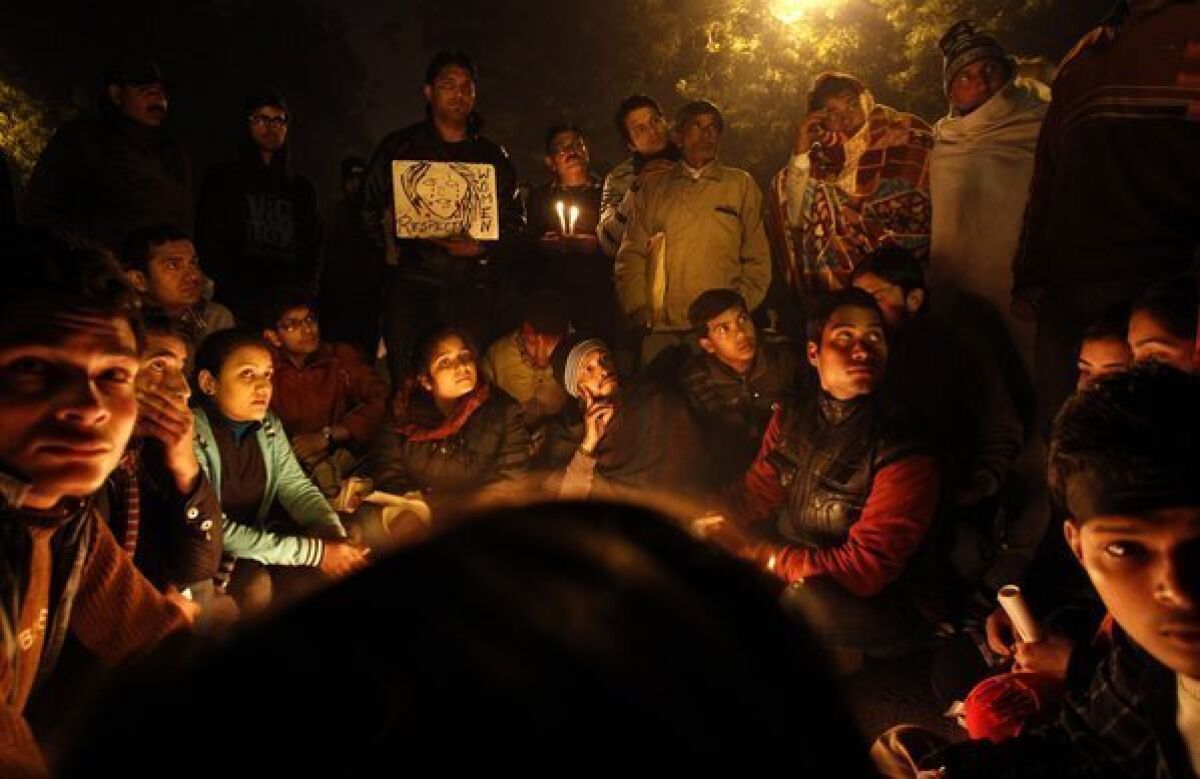 Indians gather for a candlelight vigil Thursday in memory of a gang-rape victim in New Delhi. Prosecutors say they will seek the death penalty against five men charged in the assault and try them in a fast-track court.