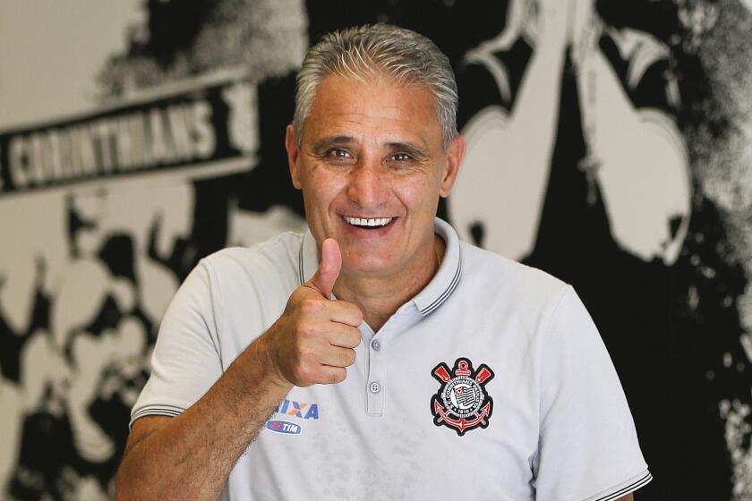Corinthians Coach Adenor Leonardo Bacchi, known as Tite, flashes a thumbs up after a team training session in Sao Paulo, Brazil on Dec. 5, 2015.