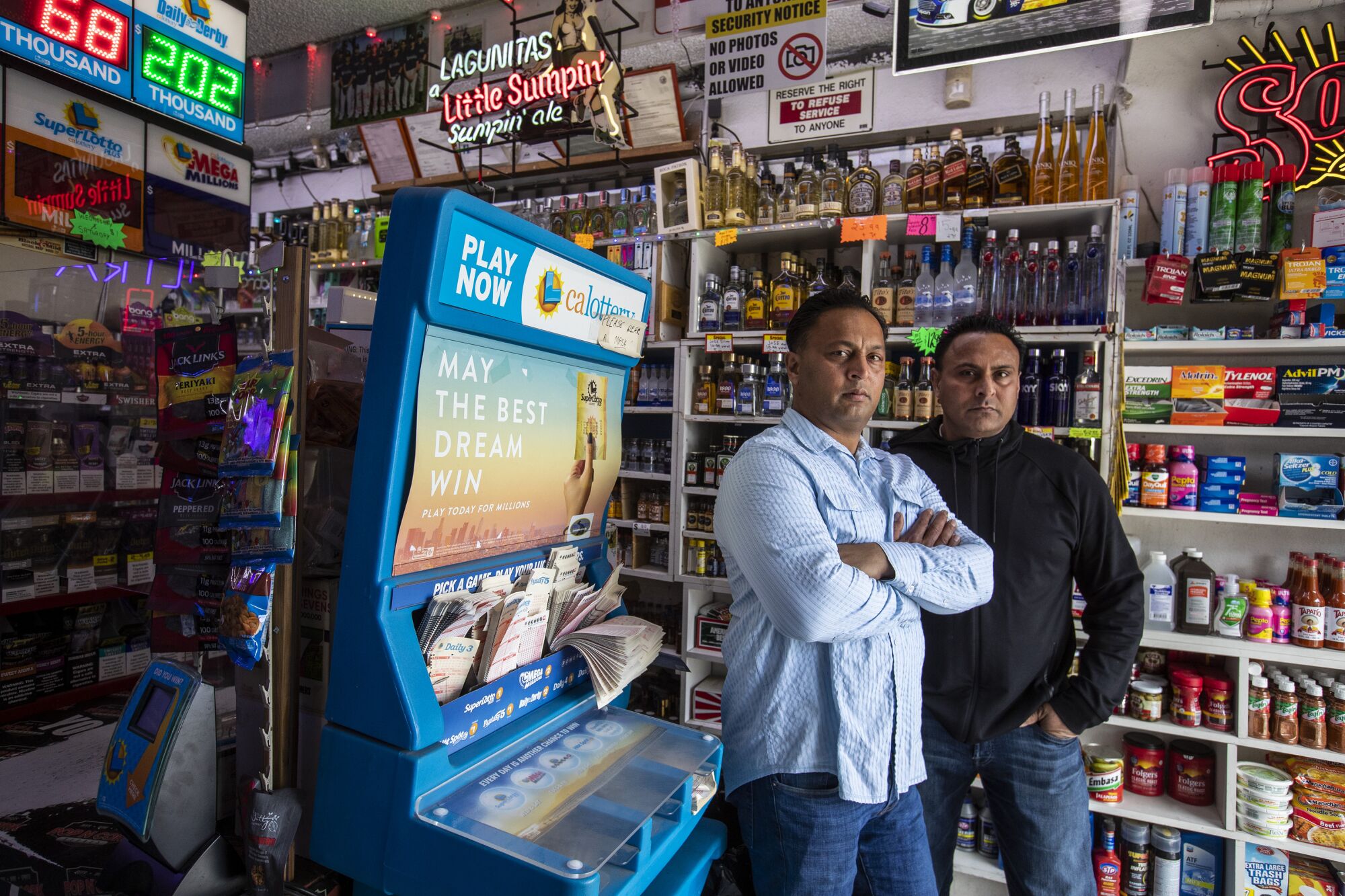 Brothers Baljit "Bobby" Athwal, left, and Daljit "Dee" Atwal at their Pop N Cork liquor store
